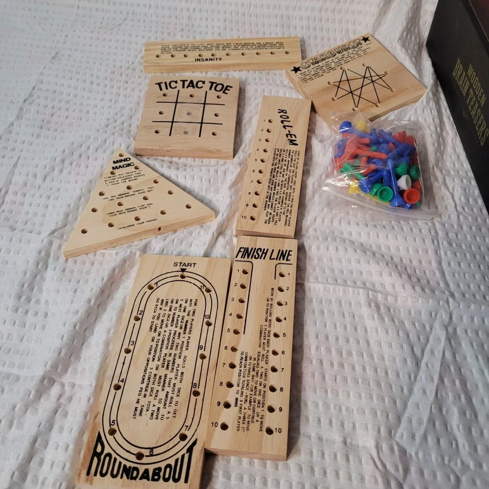 Wooden Brain Teasers 7 Piece Game Set Tic Tac Toe Mind Magic Roundabout Dice Peg